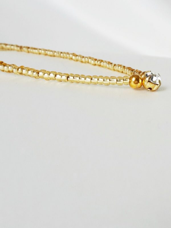 colllier-dos-perles-strass sautoir de dos pour la mariée en perles de rocailles dorées transparentes et cristaux de swarovski